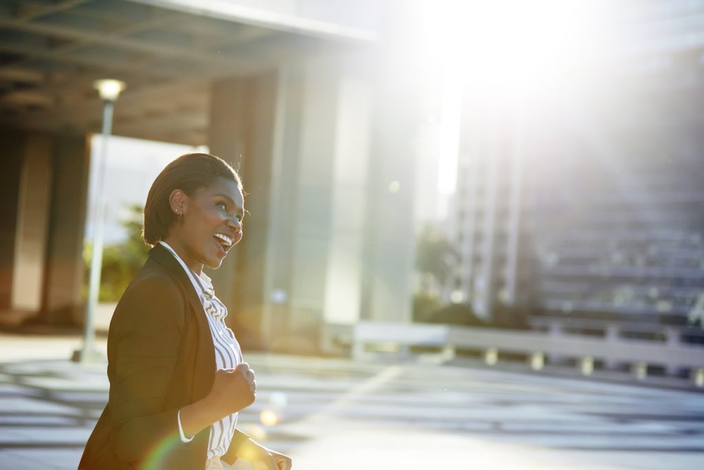 Happy businesswoman winning in life